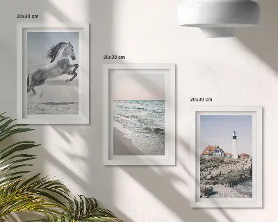 Photo frame wall set horses in motion on the beach with a lighthouse and water waves
