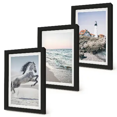 Photo frame wall set horses in motion on the beach with a lighthouse and water waves