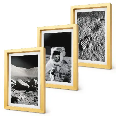 Photo frame wall set featuring moon photography with an astronaut and footprint