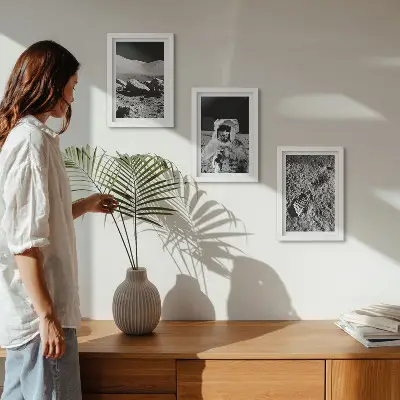Photo frame wall set featuring moon photography with an astronaut and footprint