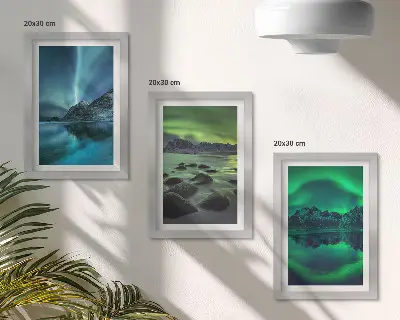 Photo frame wall with a winter landscape featuring northern lights and mountains