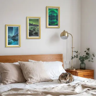Photo frame wall with a winter landscape featuring northern lights and mountains