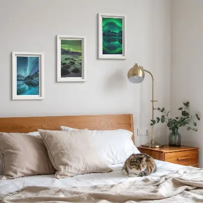 Photo frame wall with a winter landscape featuring northern lights and mountains