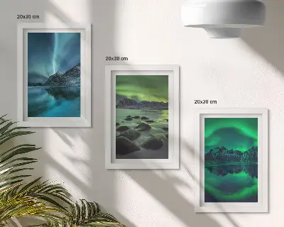 Photo frame wall with a winter landscape featuring northern lights and mountains