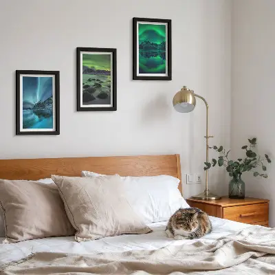 Photo frame wall with a winter landscape featuring northern lights and mountains