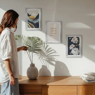 Photo frame wall with abstract mountains, flowers, and inspiring lettering