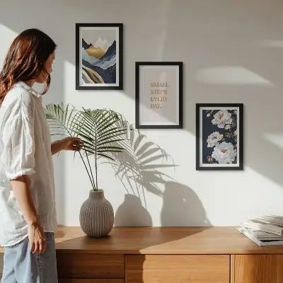 Photo frame wall with abstract mountains, flowers, and inspiring lettering
