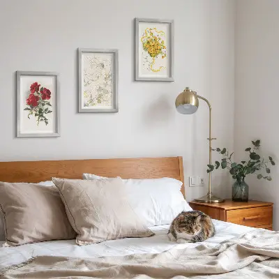 Photo frame wall with red roses, white figure, and yellow flowers in a vase