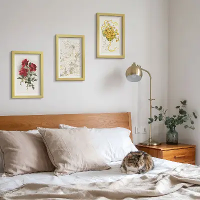 Photo frame wall with red roses, white figure, and yellow flowers in a vase