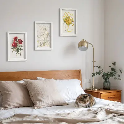Photo frame wall with red roses, white figure, and yellow flowers in a vase