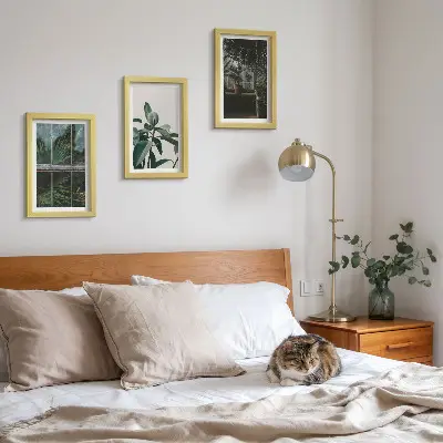 Green leaves on the window and plants inside framed triptych