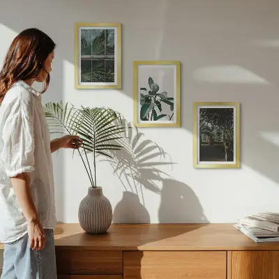 Green leaves on the window and plants inside framed triptych