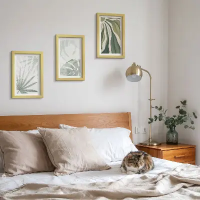 Photo frame wall with green and gray plant leaves