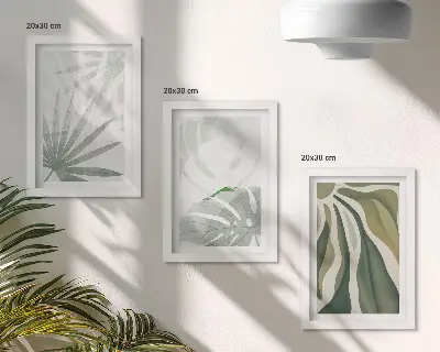 Photo frame wall with green and gray plant leaves