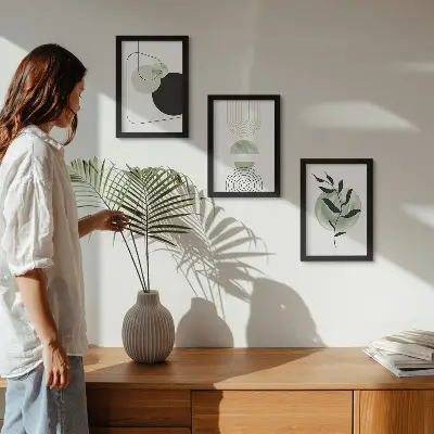 Photo frame wall gallery with abstract shapes and green plant motifs