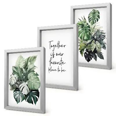 Photo frame wall with tropical green leaf prints and decorative text