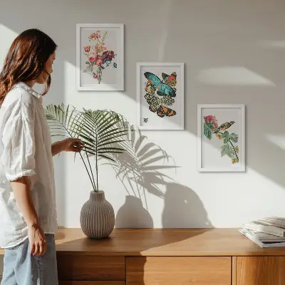 Flowers, butterflies and a bird triptych framed artwork in pastel shades