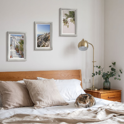 Photo frame wall White stairs in Santorini with a view of the town