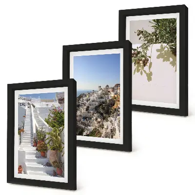 Photo frame wall white stairs in Santorini with a town view