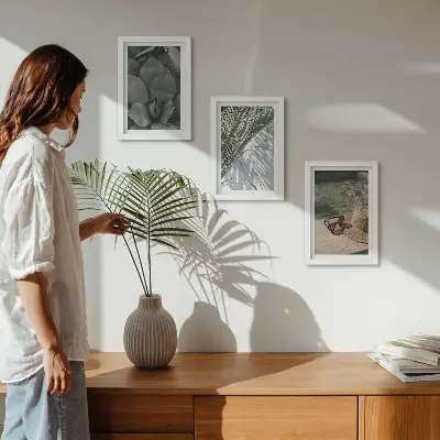 Photo frame wall with tropical plants and summer holiday accents