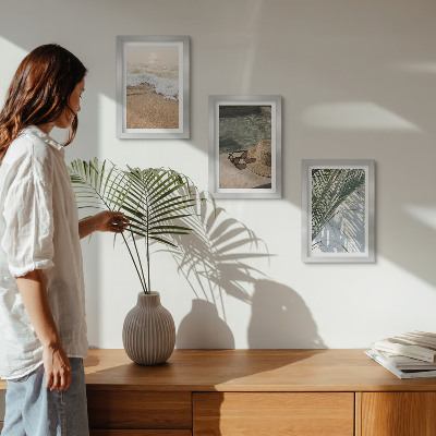 Photo frame wall Water beach hat and sunglasses leaves