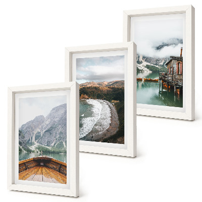 Framed triptych View of the mountains over the lake with a boat and a beach landscape