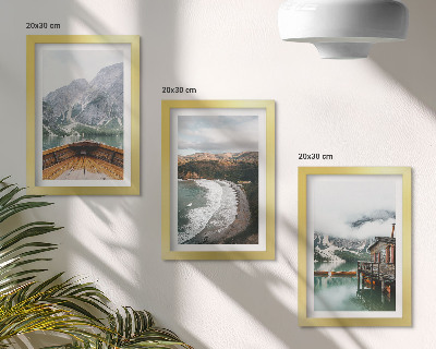 Framed triptych View of the mountains over the lake with a boat and a beach landscape