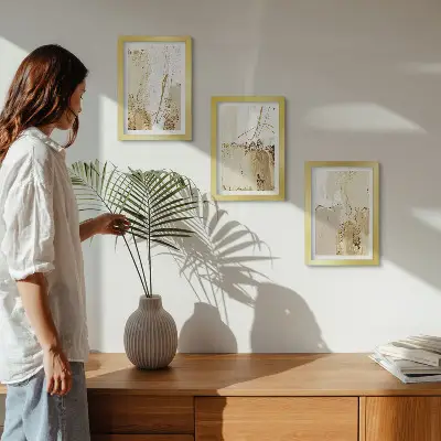 Photo frame wall with abstract patterns in shades of beige and white