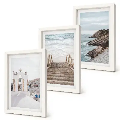 Photo frame wall featuring views of the sea and Santorini architecture against the sky