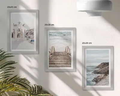 Photo frame wall featuring views of the sea and Santorini architecture against the sky