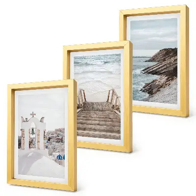 Photo frame wall featuring views of the sea and Santorini architecture against the sky