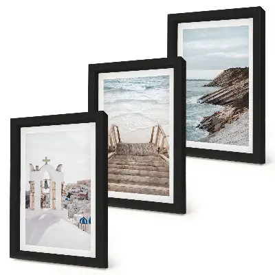Photo frame wall featuring views of the sea and Santorini architecture against the sky