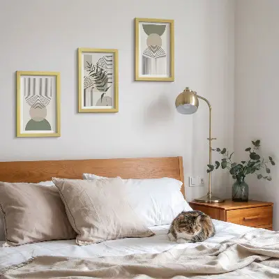 Abstract shapes in shades of green and beige framed triptych