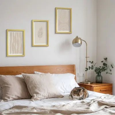 Framed triptych featuring plant motifs in shades of beige