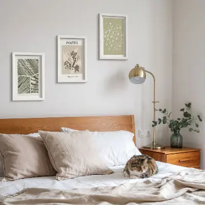 Photo frame wall with plant motifs in subdued colors and patterns