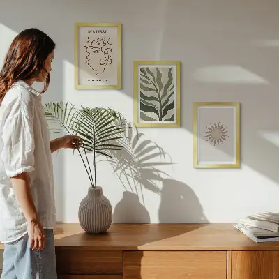Photo frame wall with abstract plant patterns and lines in muted colors