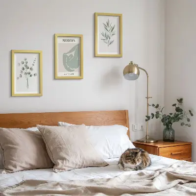 Photo frame wall with plant motifs in delicate shades of green