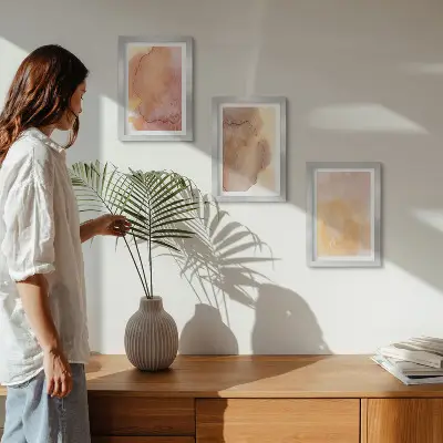 Photo frame wall with warm watercolor canvas art and colorful textures
