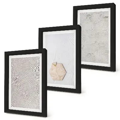 Photo frame wall light textures on the sand in a delicate boho style