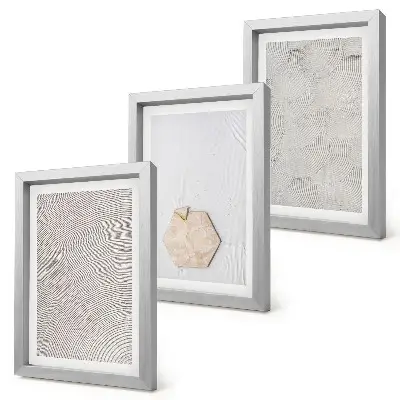 Photo frame wall light textures on the sand in a delicate boho style