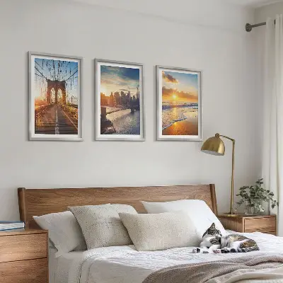 Wall art set featuring a bridge during a city sunset