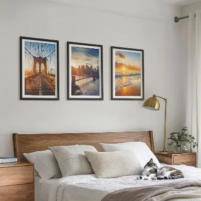 Wall art set featuring a bridge during a city sunset