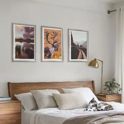 Set of 3 framed wall art pieces featuring mountain landscapes with reindeer