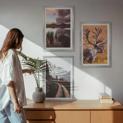 Set of 3 framed wall art pieces featuring mountain landscapes with reindeer