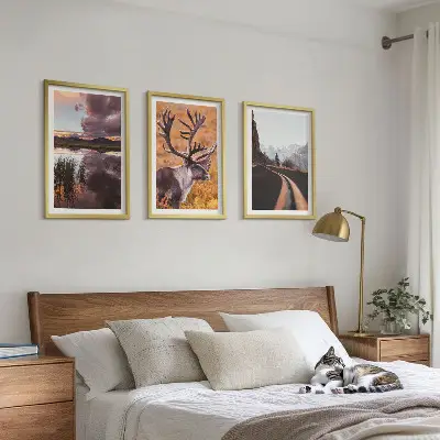 Set of 3 framed wall art pieces featuring mountain landscapes with reindeer