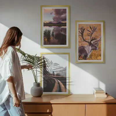 Set of 3 framed wall art pieces featuring mountain landscapes with reindeer
