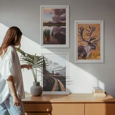 Set of 3 framed wall art pieces featuring mountain landscapes with reindeer