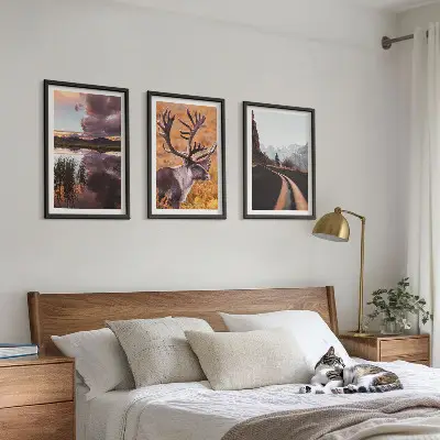 Set of 3 framed wall art pieces featuring mountain landscapes with reindeer