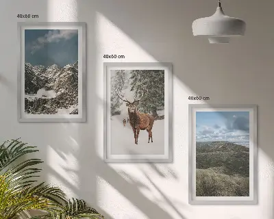 Set of 3 framed wall art pieces featuring a snowy mountain forest and deer landscape