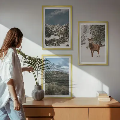 Set of 3 framed wall art pieces featuring a snowy mountain forest and deer landscape